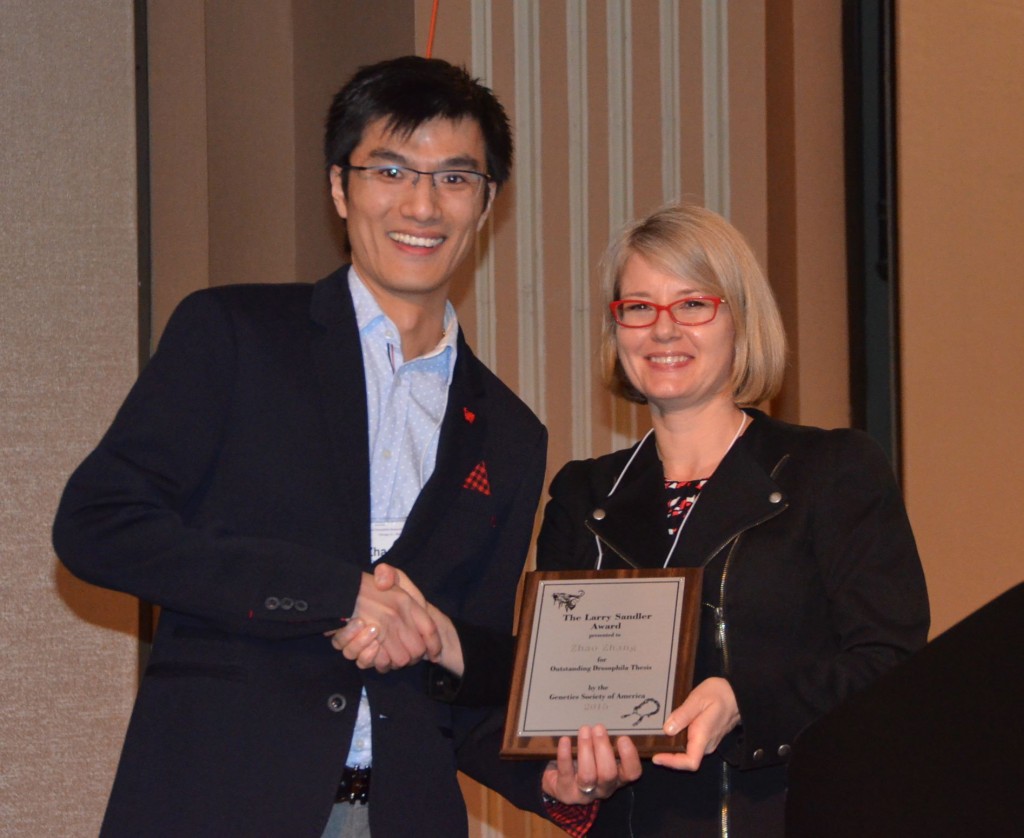 Zhao Zhang receives the 2015 Larry Sandler Memorial Award from Erika Bach