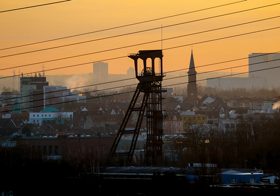 Sunrise over the city of Bochum, in the foreground the winding tower of the former mine "Holland" (all mines were named, e.g. after people, places, organizations).