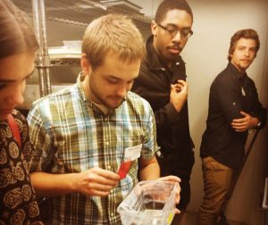Photo of University of Pennsylvania graduate student giving undergraduate students a lab tour.