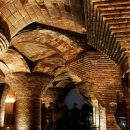 Image: Photograph of supportive brick arches in the basement of the Palau Güell by V C via Flickr, CC BY-NC 2.0 license.