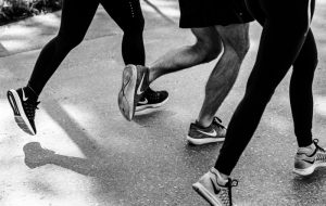 Image: photo focused on the feet of three people running by aquachara via Unsplash, Unsplash License.